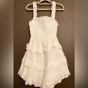 This dress by Indikah is size small and a bright white color.